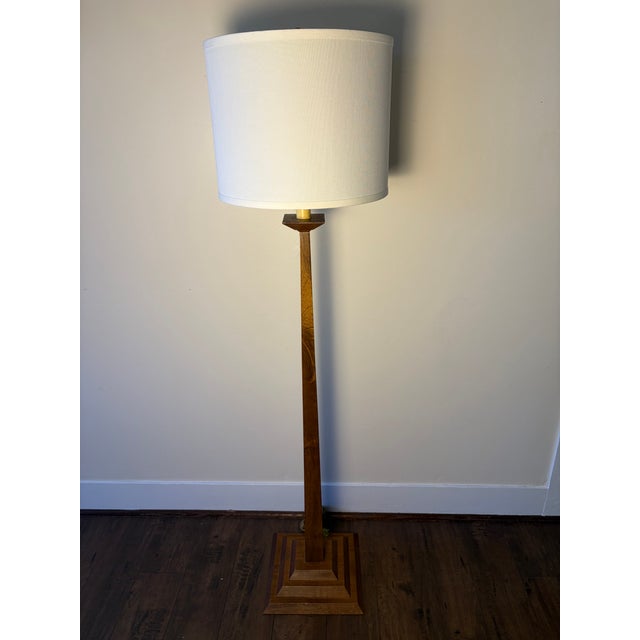 Striking vintage wood floor lamp with a tall, slender architectural profile and sculptural stepped geometric base. The...