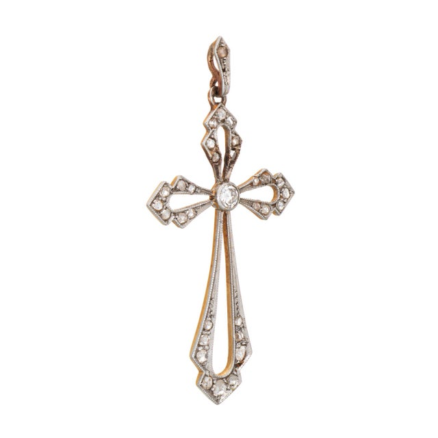 Finely detailed antique diamond cross pendant crafted in 18k yellow gold and platinum (circa 1880s to 1900s). Crafted in...