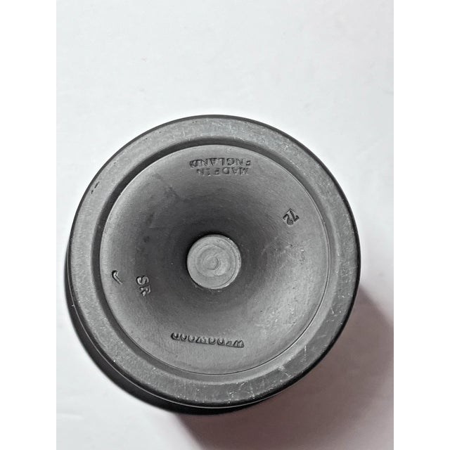 Elegant vintage 1965 Wedgwood Arcadian vase featuring a sophisticated combination of black basalt and Jasperware. This...