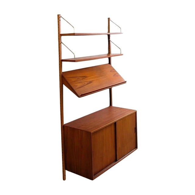 We are offering a beautiful "Royal System" wall shelf by Poul Cadovius from the 1960s for sale. The shelving system...