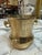 Classic vintage solid brass champagne bucket featuring a gracefully shaped body with a flared rim, rounded base, and...