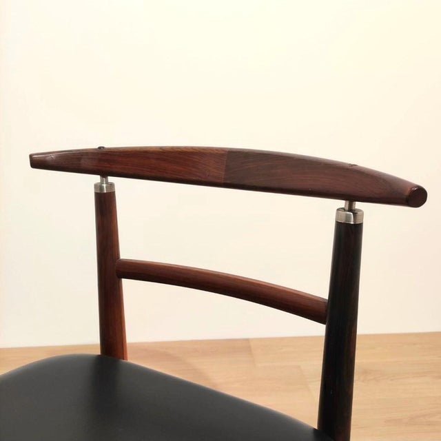 Elegant pair of Danish chairs produced by Sibast Furniture, designed by Helge Sibast & Borge Rammeskov. These chairs are...