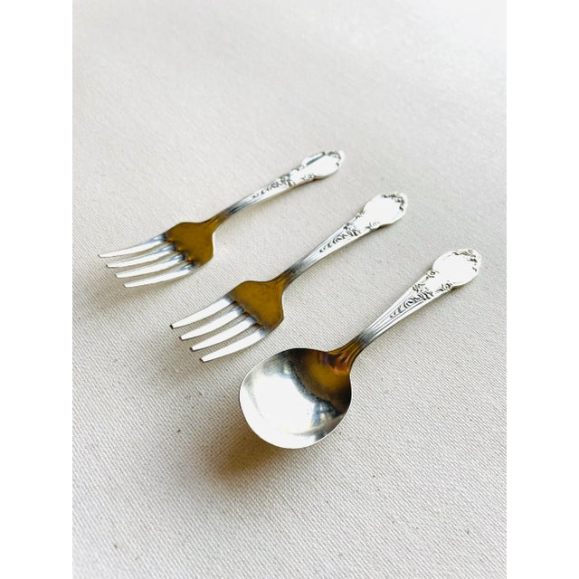 Vintage silver plate floral design set of 3 baby flatware includes ( 2 forks , 1 spoon) they are 4"L , makers mark reads "...