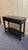 Sleek and elegant, this Asian-inspired black lacquered console table offers a timeless design with modern versatility. Its...