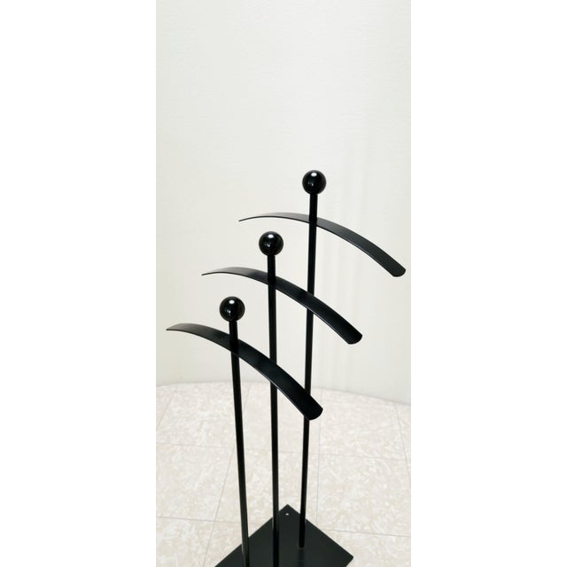 Unique and supremely cool garment rack likely produced in the late 80s/early 90s. Small possibility it was made by fly...