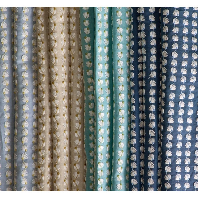 This flowering embroidery evokes the illusion of a whimsical daisy chain. Small in scale with a raised texture in the...