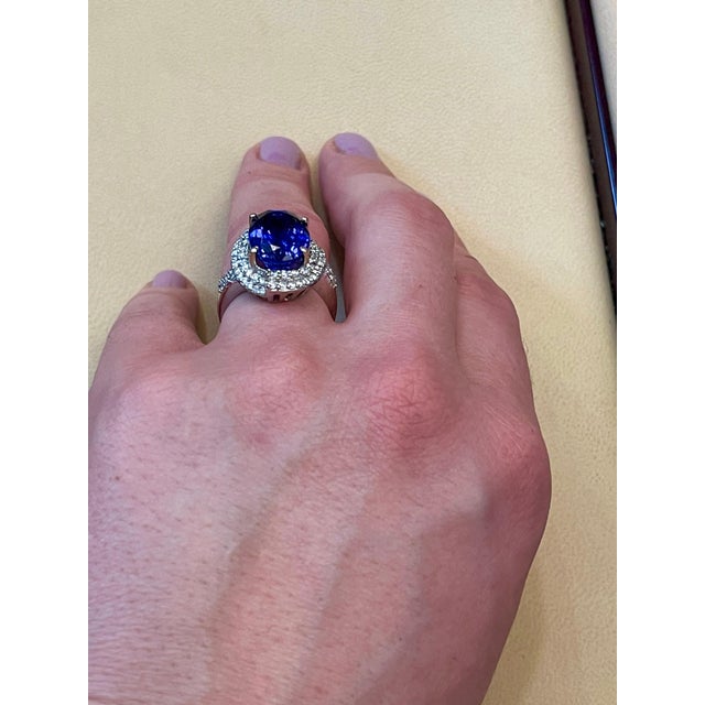 This extraordinary 8.5 carat tanzanite is a true gemstone that is highly treasured. It is surrounded by a total of 2.0...