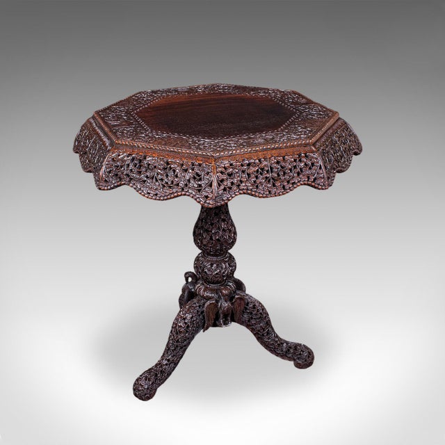 This is an antique carved lamp table. A Burmese, octagonal teak colonial table, dating to the mid Victorian period, circa...