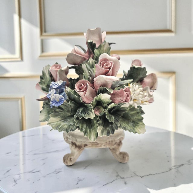 Nuova Capodimonte porcelain floral centerpiece in the form of a basket with hand-formed and hand-painted roses, rosebuds,...