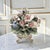 Nuova Capodimonte porcelain floral centerpiece in the form of a basket with hand-formed and hand-painted roses, rosebuds,...