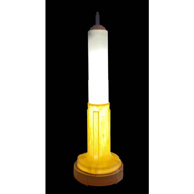 Striking and sculptural celluloid Art Deco fluorescent table lamp modeled after the iconic silhouette of the Empire State...