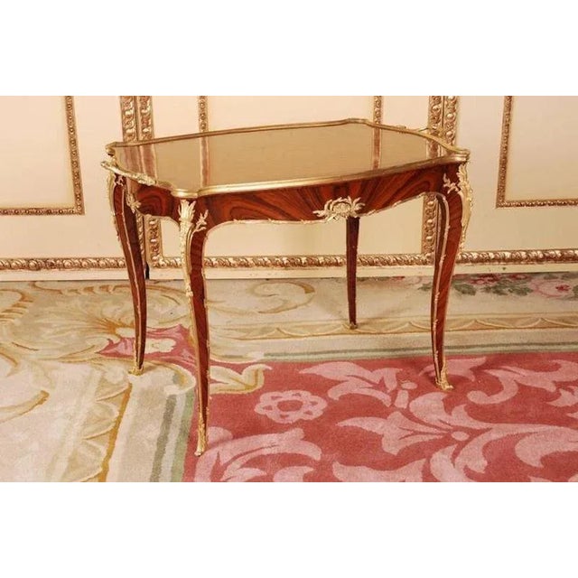 Solid beech, lightly curved convex and concave body, flanked by out-standing pilaster strips on high legs, below a...