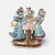 This antique hand painted porcelain Royal Rudolstadt German figurine is in good condition as pictured with several small...