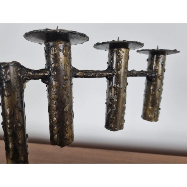 Vintage brutalist torch cut metal candle holder with 6 arms. Beautiful and timeless piece which is very decorative. The...