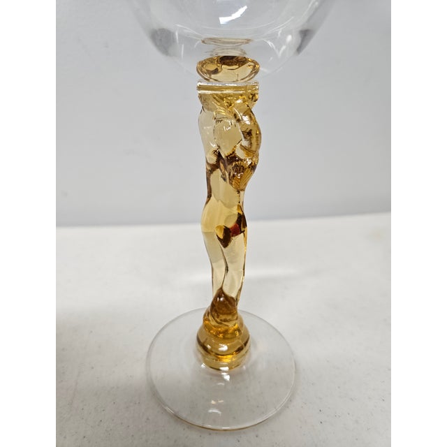 A set of four vintage figural nude-stem cocktail glasses attributed to the Cambridge Glass Company "Statuesque" pattern,...