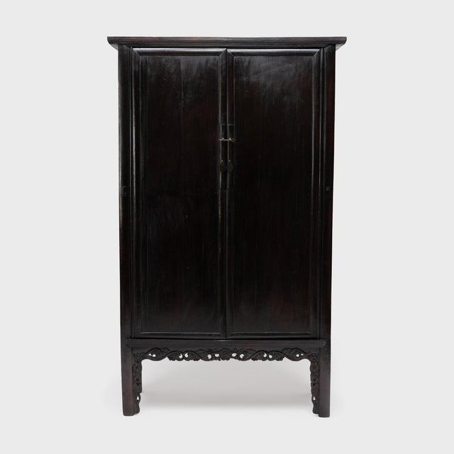 A classic piece of Chinese furniture, this pair of tall lacquered cabinets was likely part of a traditional wedding dowry,...