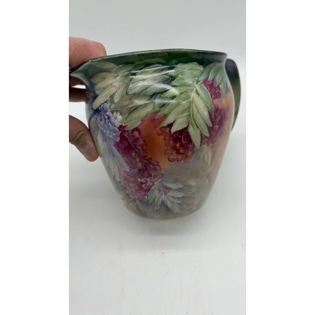 A Rare Hand Painted Jean Pouyat Limoges Porcelain Pitcher by F. M. Wood, Circa 1900 Made by the French Company Jean Pouyat...