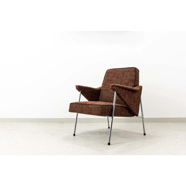 An armchair manufactured by Fabryka Mebli Wschód in Zadziele, Poland, in the 1960s. The seat has been newly re-padded and...