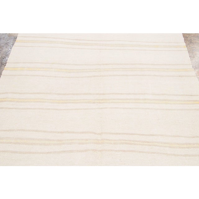 Handwoven from recycled vintage hemp and originating from Turkey circa 1950-1959, this 5x8 vintage kilim joins Rug &...