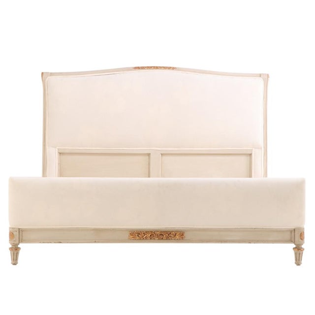 The frame features elegant floral carvings highlighted with giltwood accents, adding refined detail to the clean,...