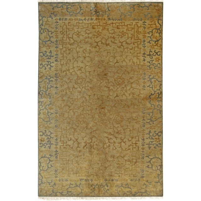Warm Bianca Yellow Hand Knotted Wool Rug, Country of Origin: China. This exquisite hand-knotted wool piece presents a...