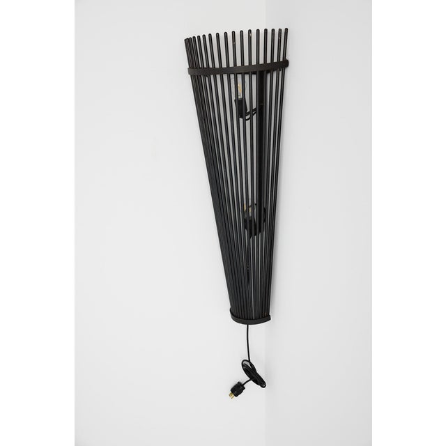 Set of Three Monumental Modernist Steel Rod Wall Sconces, Switzerland An exceptional set of three monumental wall sconces...