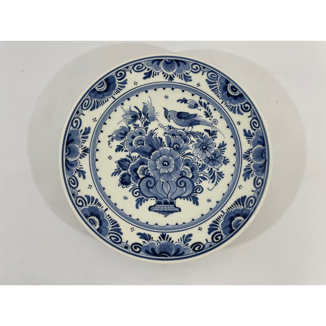 A stunning traditional Blue and White Dutch Delft faience plate from the Mid 20th Century. Made in Holland with makers...