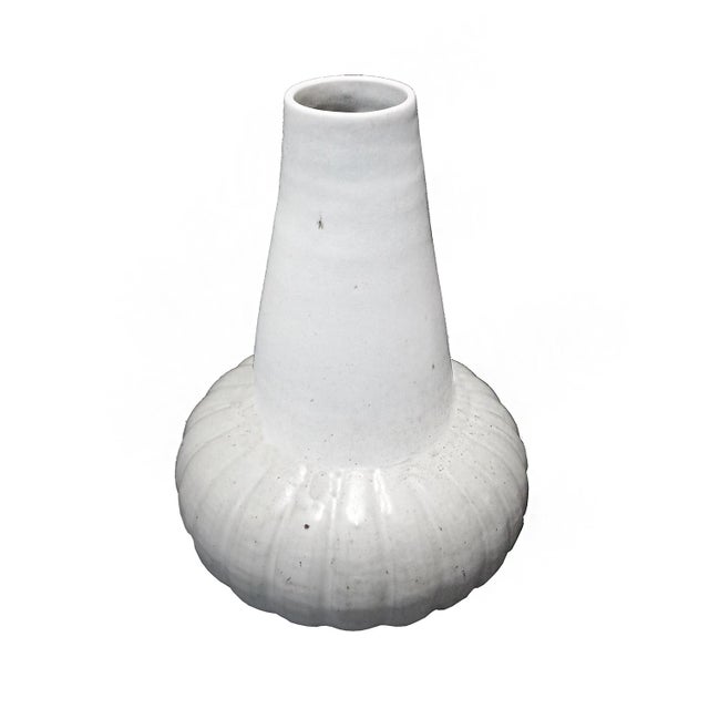 A ceramic vase from Thailand, with off-white glaze. Contemporary. While the golden age of Thai ceramics ended around the...