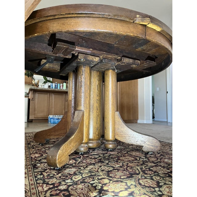 The antique round pedestal supported dining table is a stylish and elegant piece of furniture for any dining room. Made of...