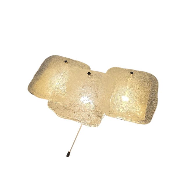 A piece of contemporary design history: the "kreuzenstein" wall lamp, part of j.t. Kalmar's renowned "stone" series from...