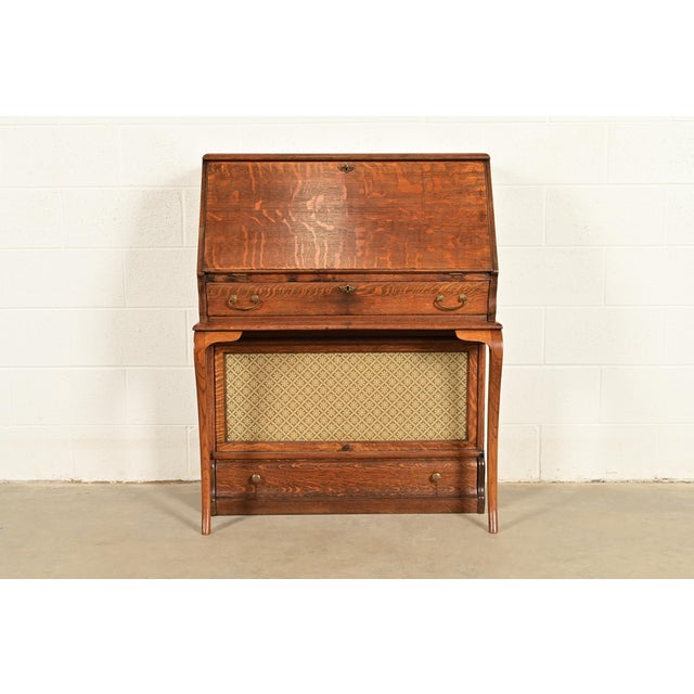 A gorgeous antique Mission or Arts & Crafts period quarter sawn tiger oak slant front writing desk with barrister bookcase...