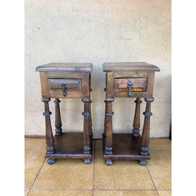 This elegant pair of Spanish Nightstands or pedestal side tables dates from the mid 20th century and reflects the Baroque...
