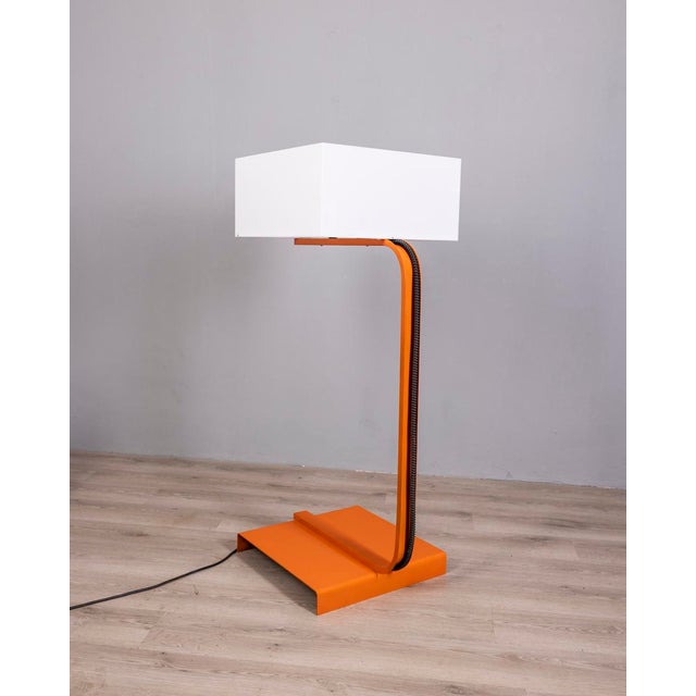 Floor lamp with orange metal frame and large white acrylic glass lampshade, Italian Space Age design, 1970s. European Plug...