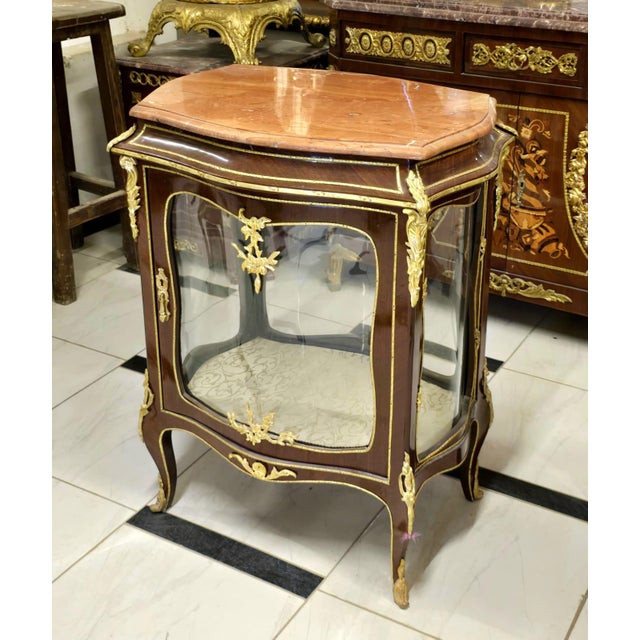 Bring timeless French elegance into your home with this exquisite French Louis XV Curio Display Cabinet, masterfully...