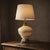 Add a touch of vintage elegance to your space with this stunning Falkenstein White with Gold Design Table Lamp from the...