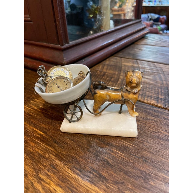 This rare little gem is a jewelry holder- more specifically the little hook in the bowl would have held a lady’s pocket...