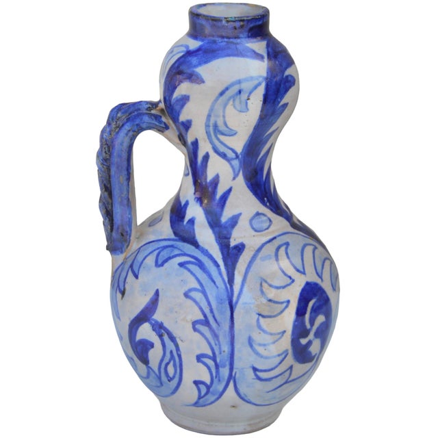 Spectacular antique Moroccan ceramic vase accent thoughtfully handcrafted and glazed exhibiting an elaborate hand-painted...