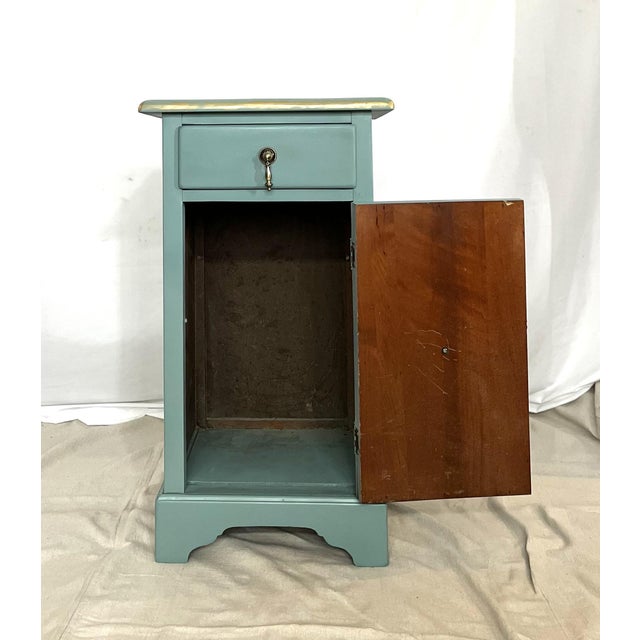 This newly restored stand features one drawer over a door that opens up to significant storage. It has been newly enameled...
