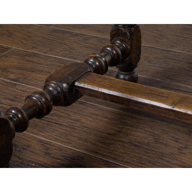 An English Georgian period walnut table circa 1800 with rectangular top, beveled edges, single drawer, slender turned...