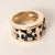 Fleur-de-lis Diamond & Black Enamel Wide Band Ring Circa 1990s A bold and sculptural vintage wide band showcasing three...