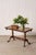 Antique English coffee table with a scalloped top, carved apron, and carved claw feet. A generous surface and classic...