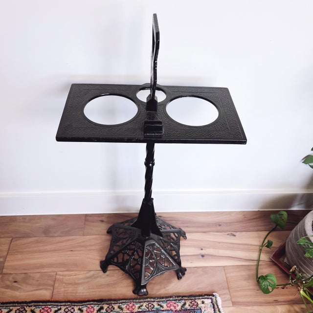 Add a touch of 1920s–30s glamour to your home with this antique Art Deco smoking stand; cast iron construction with a...