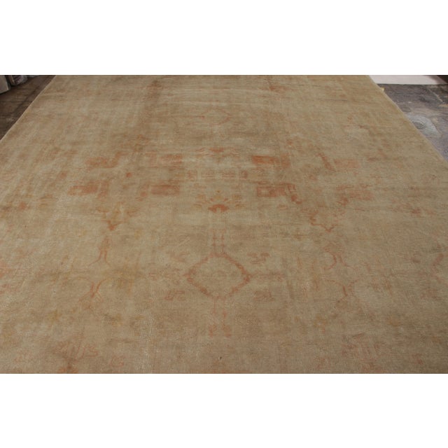 Originating from Turkey circa 1920-1930, this Oushak rug is a new entrant to Rug & Kilim’s coveted antique collection....