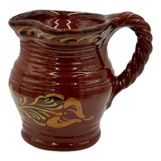 Ned Foltz 2001 Signed Redware Ruddy Glaze, Pinch Spout and Slip Decorated Pitcher With Twisted Rope Open Handle For Sale