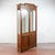 This elegant display bookcase, dating from the late 19th century, is a refined example of classic antique-style cabinetry....