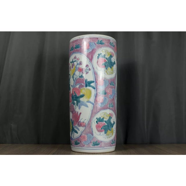 Chinse porcelain umbrella stand with many flowers and fruit in pink and other pastel colors. Hand painted, late 20th...
