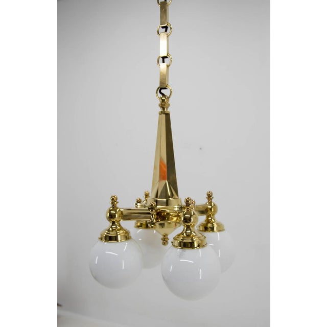 Art Deco 4-flamming chandelier in perfect condition. Chain can be shortened. Polished, rewired Original marked glass...