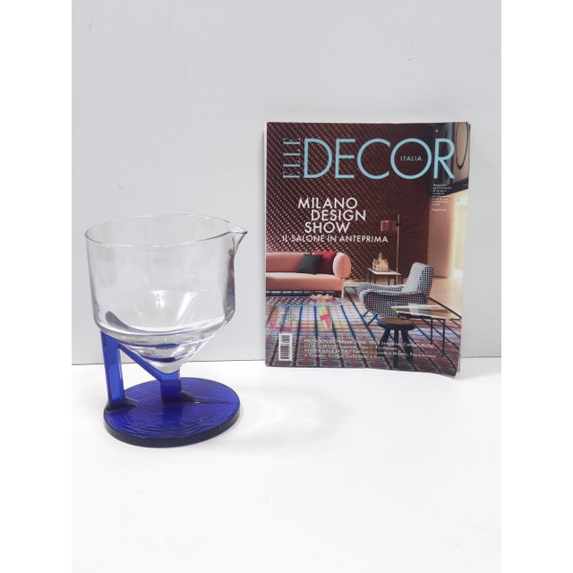 1970s. This high-quality pitcher is made in transparent and blue glass. It is a vintage piece, therefore it might show...