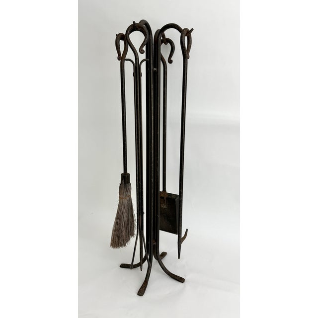 This vintage five-piece oversized fireplace tool set by Pilgrim Home & Hearth embodies a rugged' primitive aesthetic and...