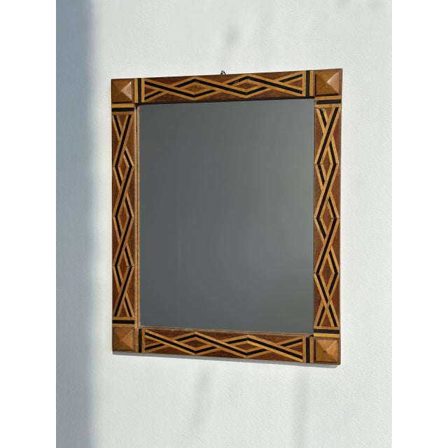Vintage Parquetry Framed Mirror with Corner Stud Details, Circa 1940s. Constructed from maple with multi-tone veneer in a...